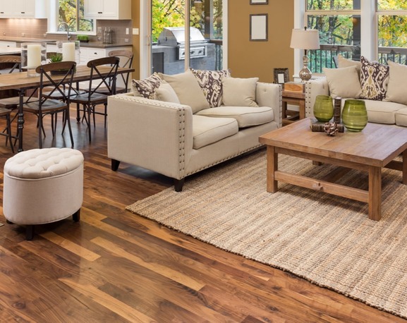 An image of a living room with a hardwood flooring
